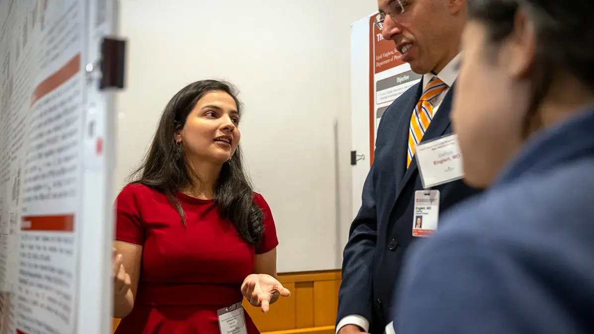 woman sharing regional data on a whiteboard with two men