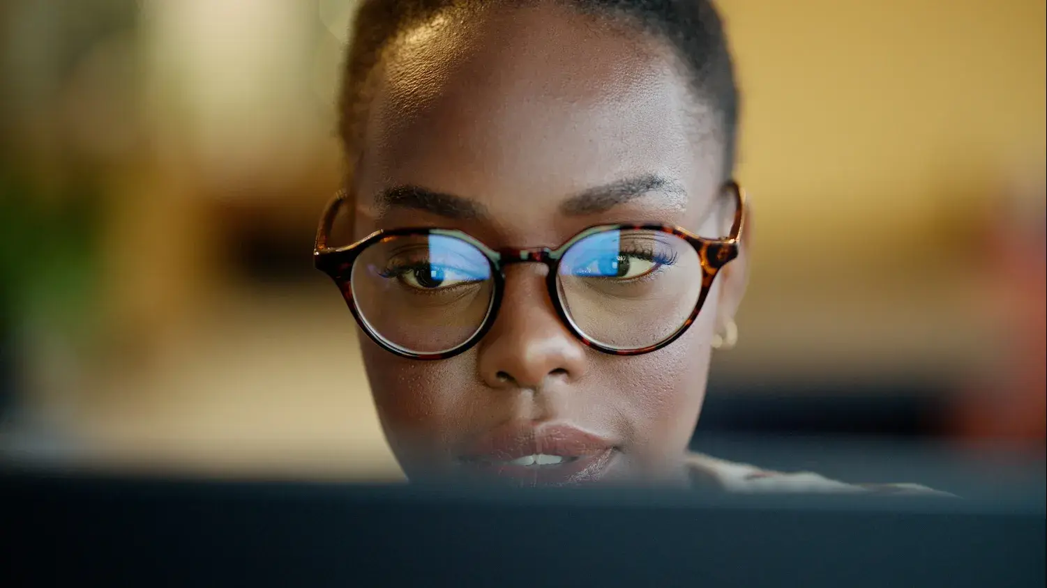 woman looking at laptop screen