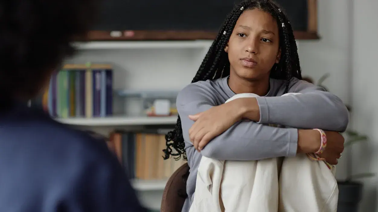 Somber teen in therapy